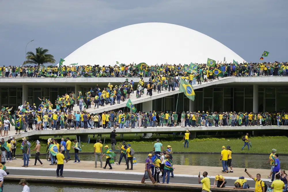 Supporters of Bolsonaro storm Brazil’s top government offices