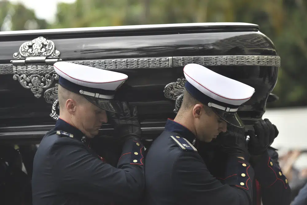 Pelé buried at cemetery in Brazilian city he made famous