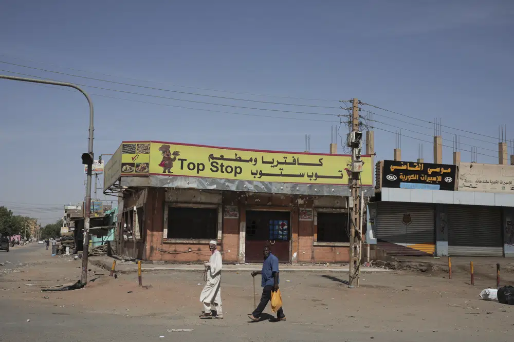 Trapped by fighting, Sudanese look for ways to survive