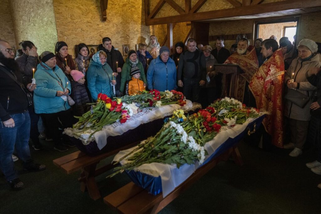 Relatives bury children killed in Russian missile attack