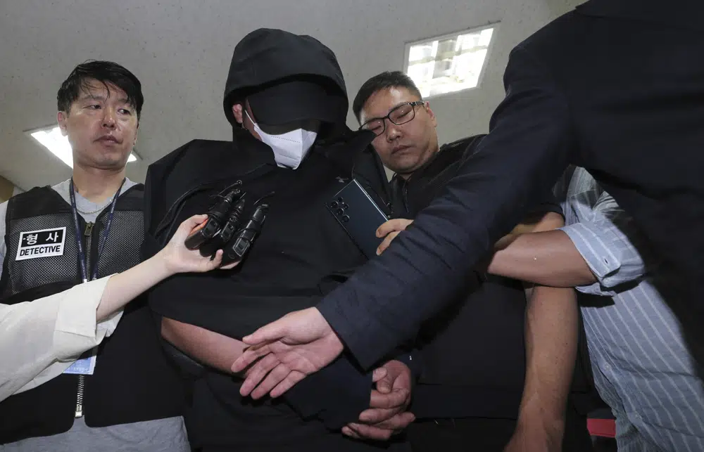 Man arrested for opening plane emergency exit door