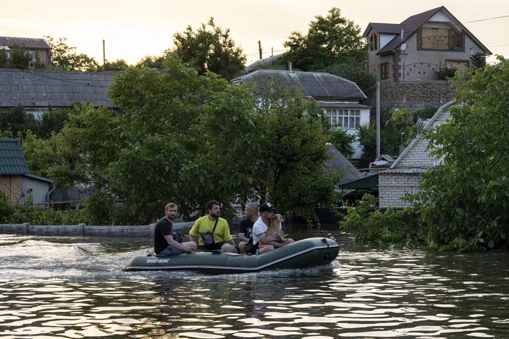 Zelenskyy visits area flooded by destroyed dam, 5 dead in Russian-occupied city