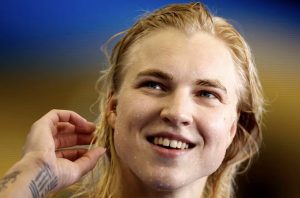 Lithuania's Meilutyte smashes world record, strong finish for US