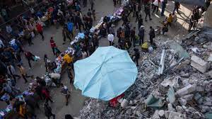 Twin Israeli Attacks Claim Lives of 29 Besieged Palestinians Awaiting Aid in Gaza