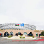 UN and Azerbaijan Flags Hoisted at Baku Olympic Stadium Ahead of WUF13 Opening